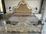 white and golden carved bed